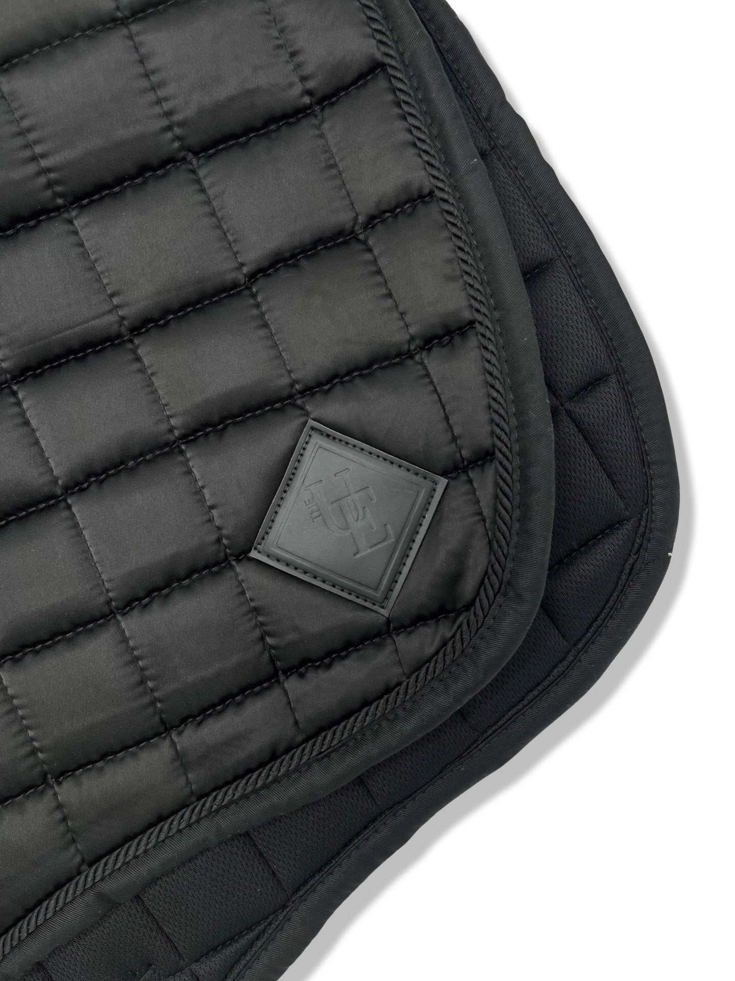 Black Satin GP Saddle Pad, from The Urbany. Elevate your horse's style with sparkling crystals and comfort.