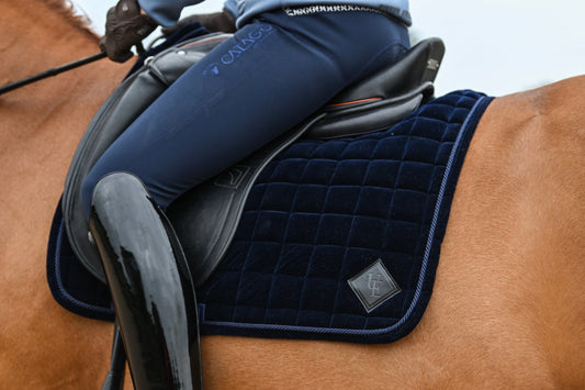 Navy Blue Velvet Dressage Saddle Pad, from The Urbany. Elevate your horse's style with sparkling crystals and comfort.