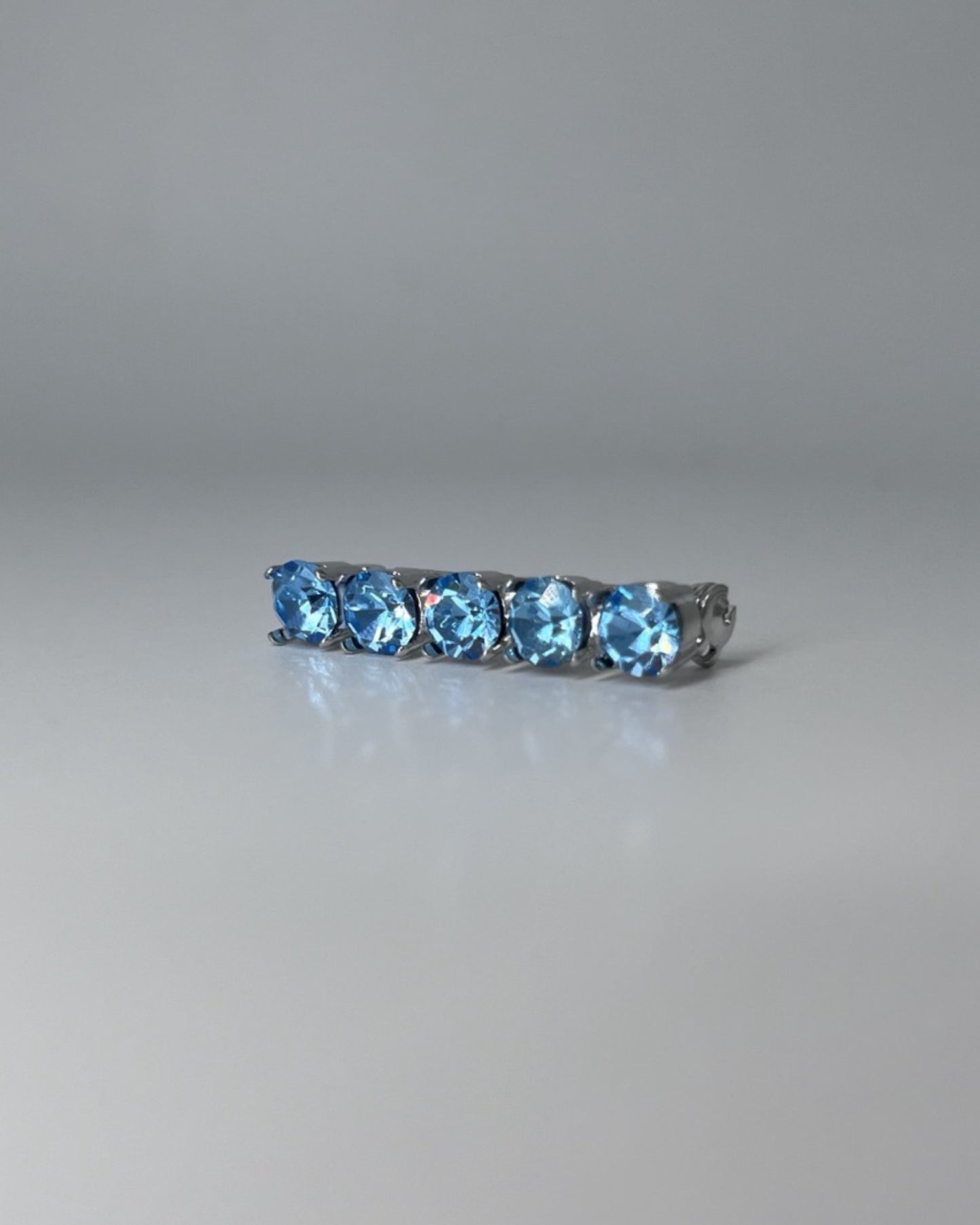 Ocean Blue Crystal Stock Pin, from The Urbany. Elevate your horse's style with sparkling crystals and comfort.