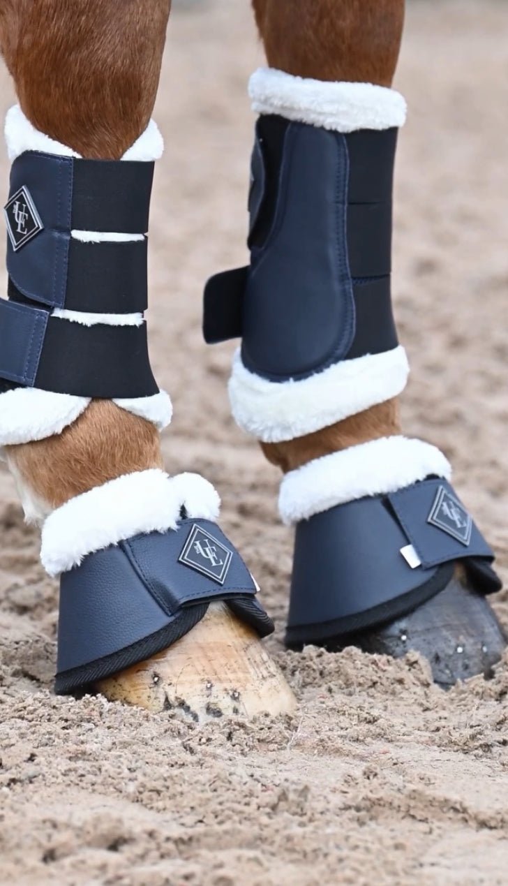 Navy Blue Fleece Trimmed Over Reach Boots, from The Urbany. Elevate your horse's style with sparkling crystals and comfort.