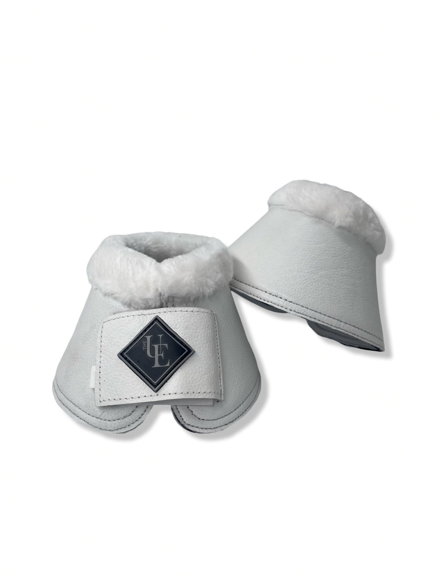 White Fleece Trimmed Over Reach Boots, from The Urbany. Elevate your horse's style with sparkling crystals and comfort.