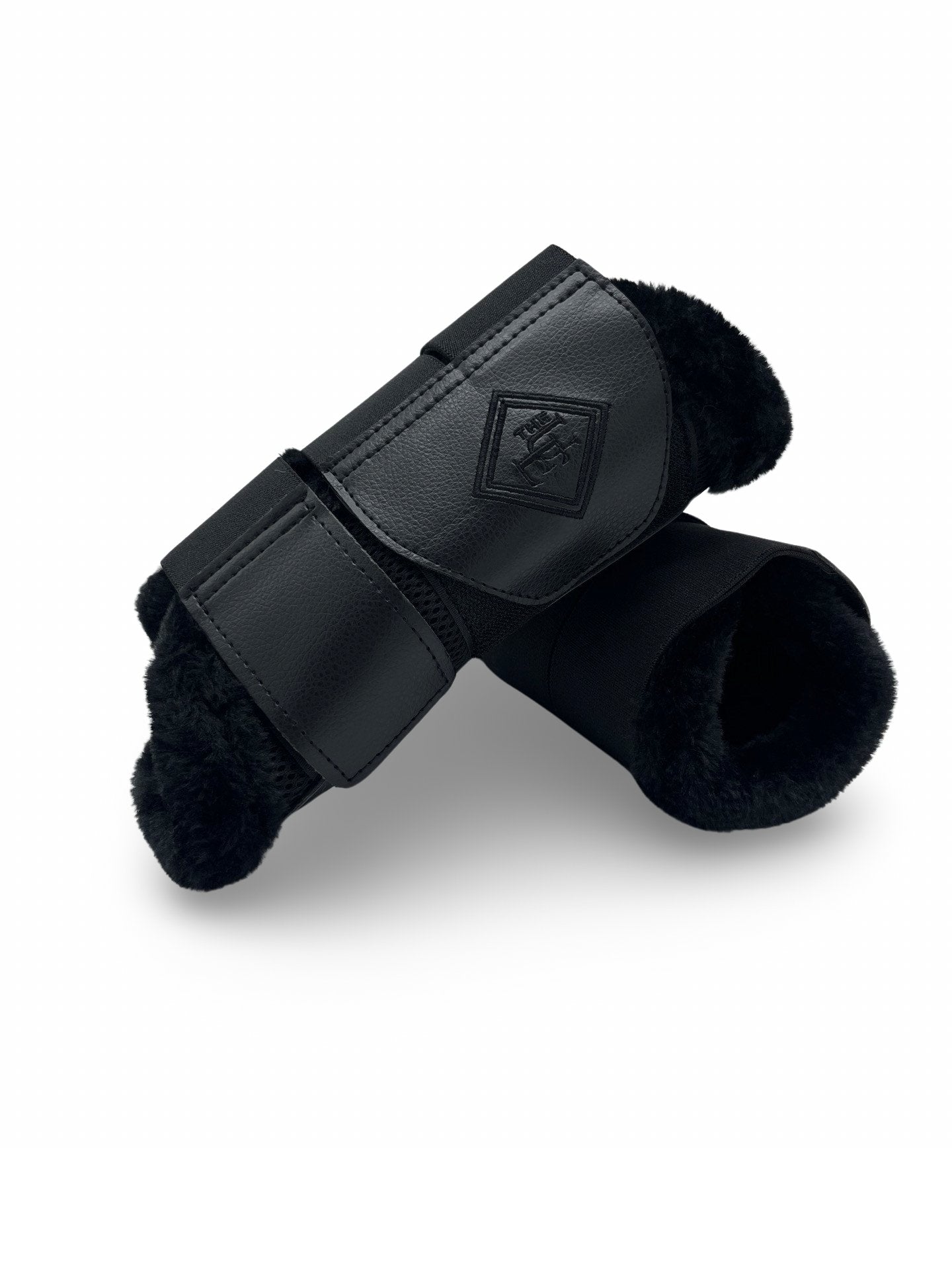 Fleece Trimmed Brushing Boots, from The Urbany. Elevate your horse's style with sparkling crystals and comfort.