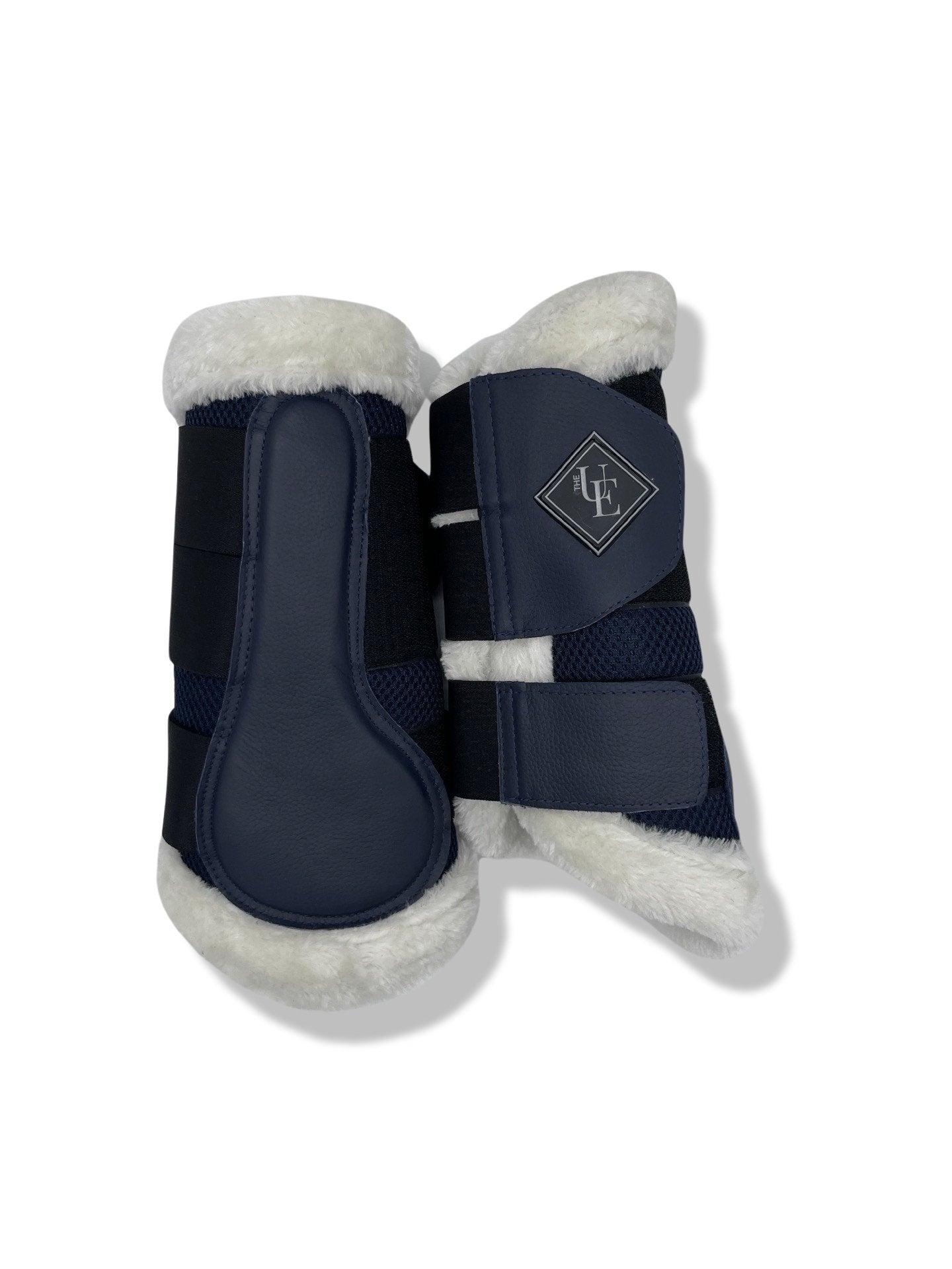 Navy Blue Fleece Trimmed Brushing Boots, from The Urbany. Elevate your horse's style with sparkling crystals and comfort.