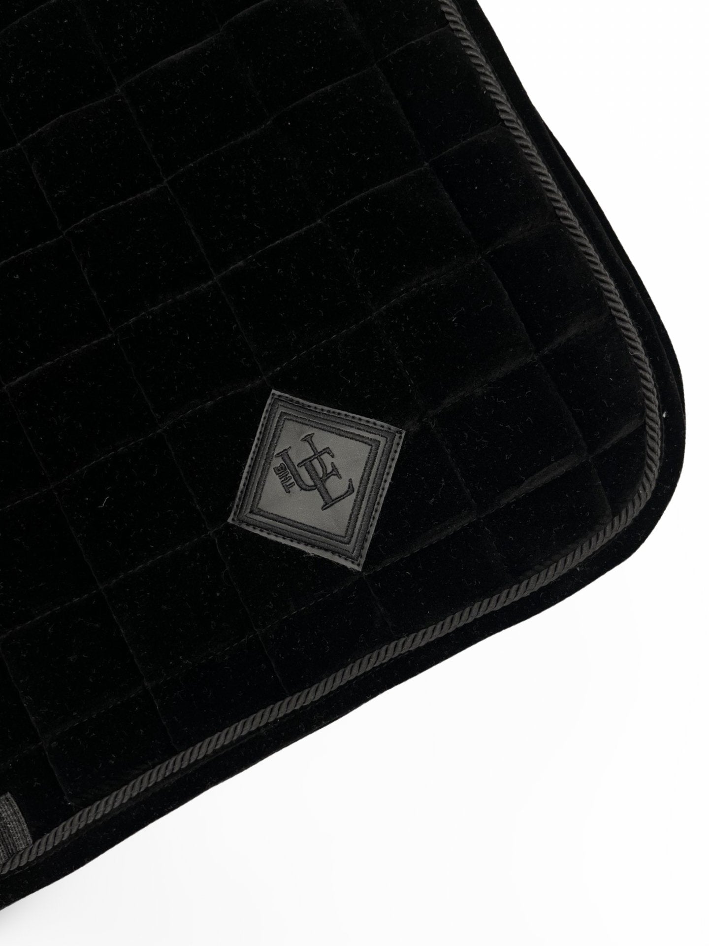 Black Velvet Dressage Saddle Pad, from The Urbany. Elevate your horse's style with sparkling crystals and comfort.